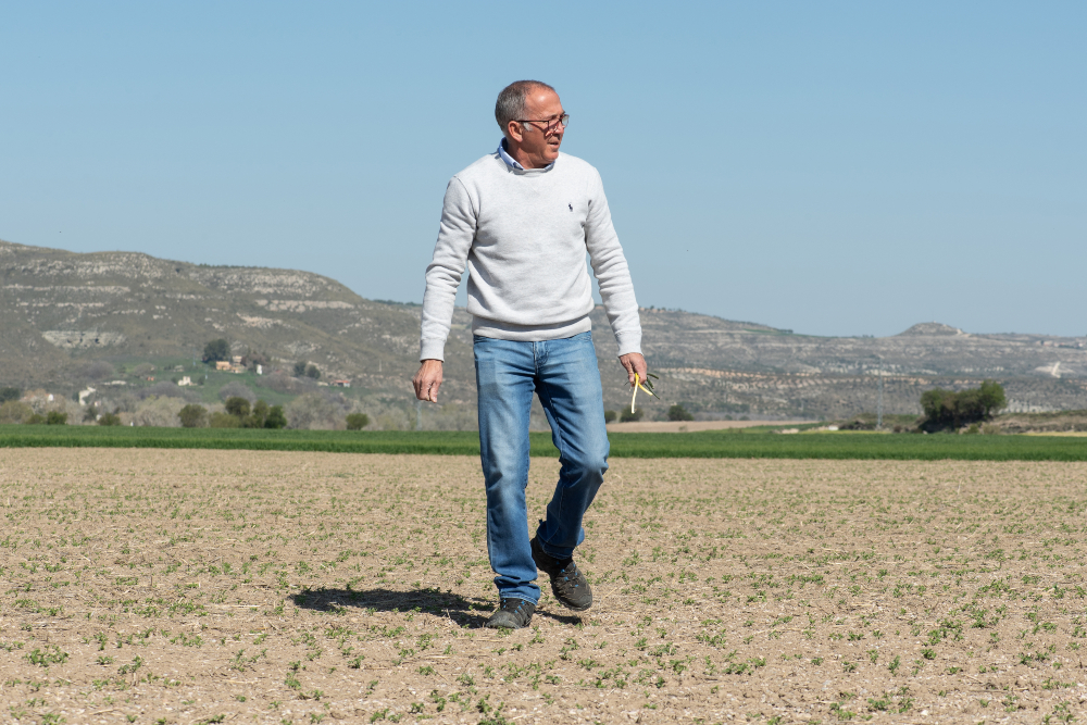 A farmer walking in a field